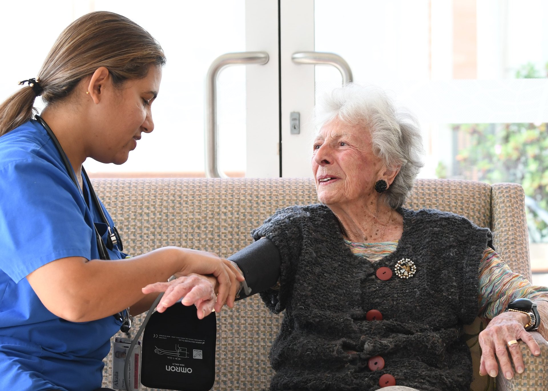 A resident having blood pressure taken
